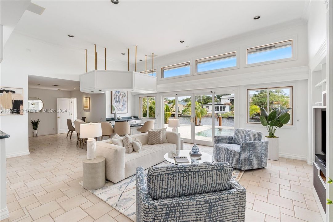 Great room overlooking pool and water view.