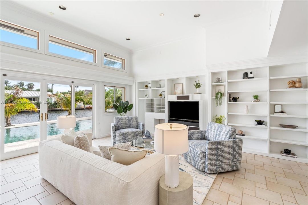 Great room overlooking pool and water view.