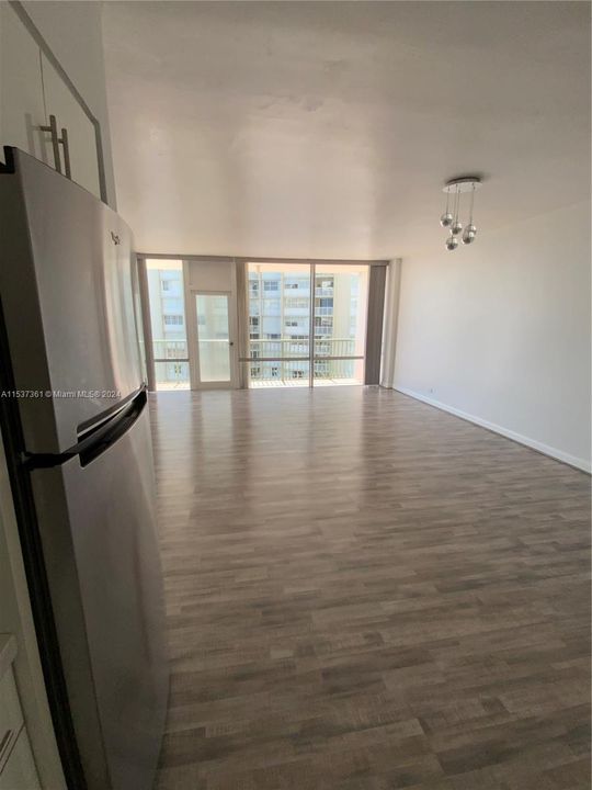 Kitchen view to living room and dinning area