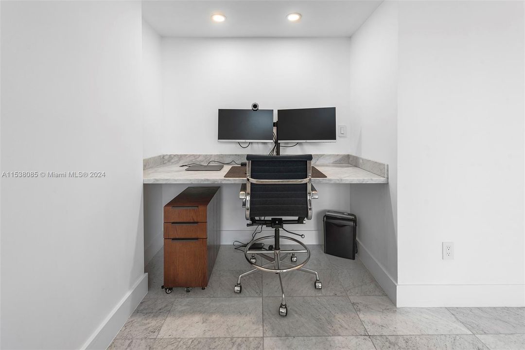 Secondary bedroom  workspace with built-in marble desk
