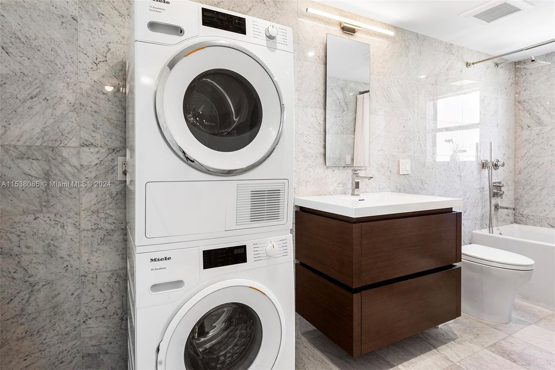 In-unit Private Miele washer and ventless dryer system.