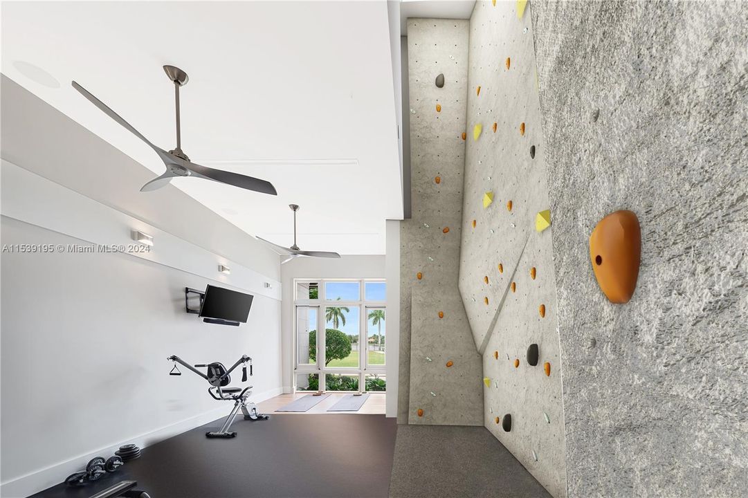 Gym space with digital rendering of rock climbing wall.