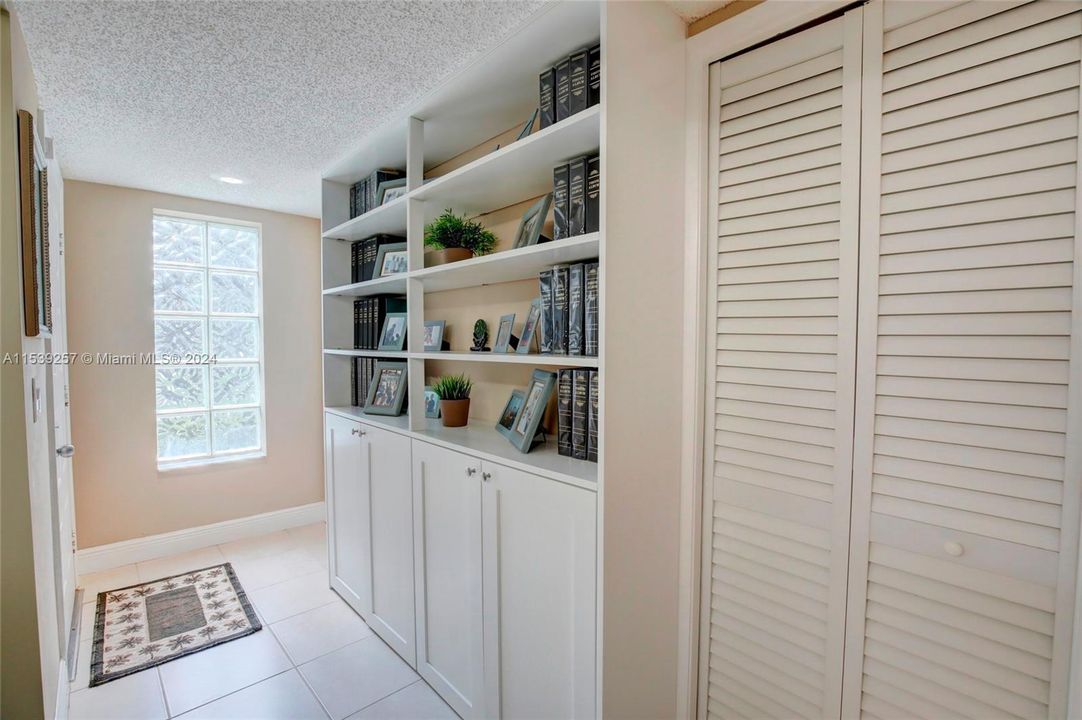 Foyer with storage closet in front by the door
