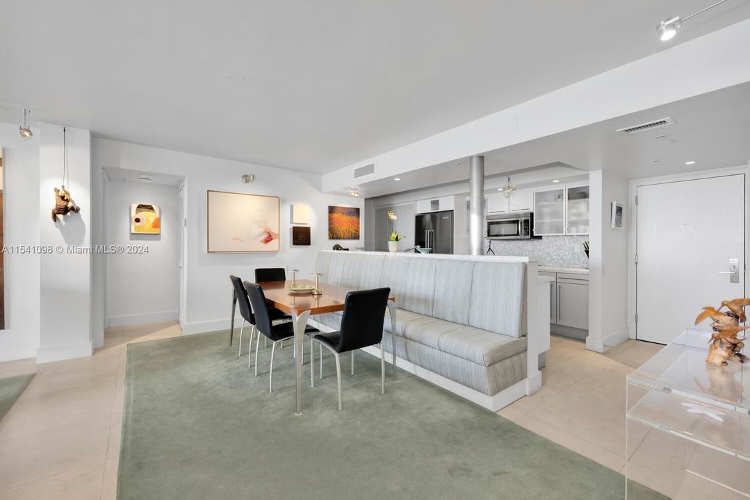 Dining Area. Large open kitchen. 1,440 sq feet. Beautiful off white high quality large time fllors throughout the entire apartment.