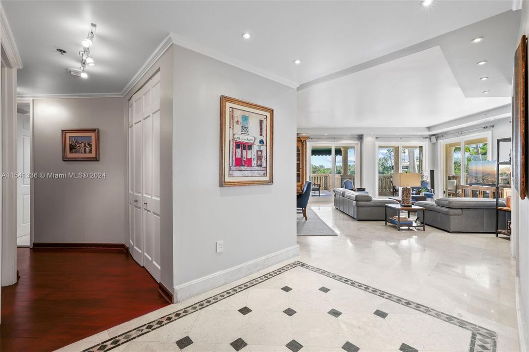 Foyer with wide entry to living/dining