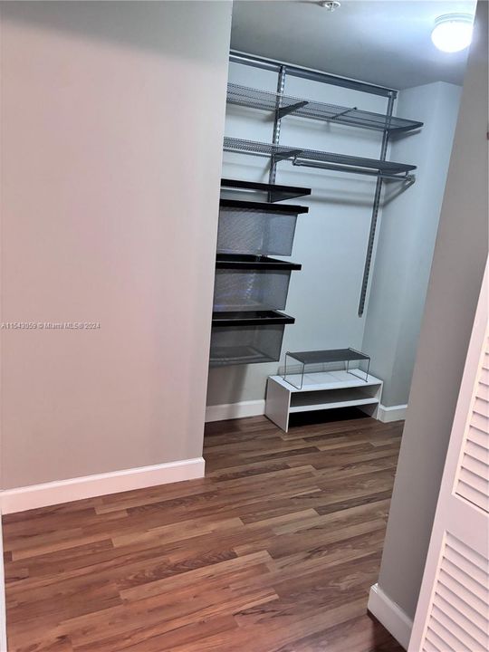 PRIMARY BEDROOM WALK-IN CLOSET