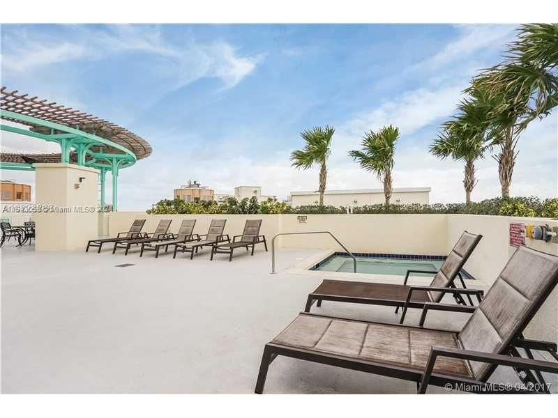 HOT TUB AREA ADJACENT TO POOL