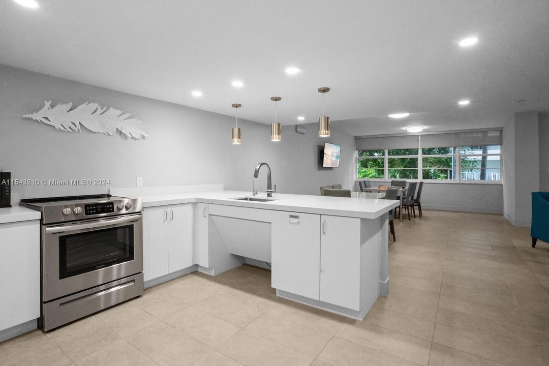 Renovated library/conference room even features a kitchen with quartz counter and stainless steel appliances.