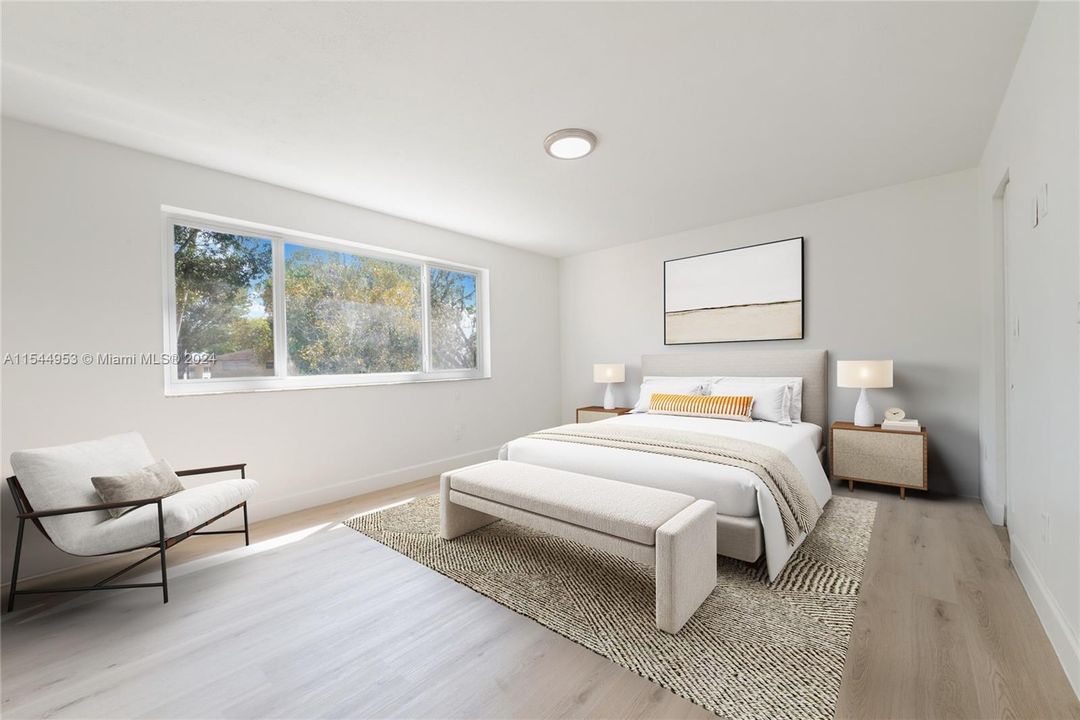Light, airy and very large primary bedroom. Virtually staged so you can imagine your own furniture in the area.