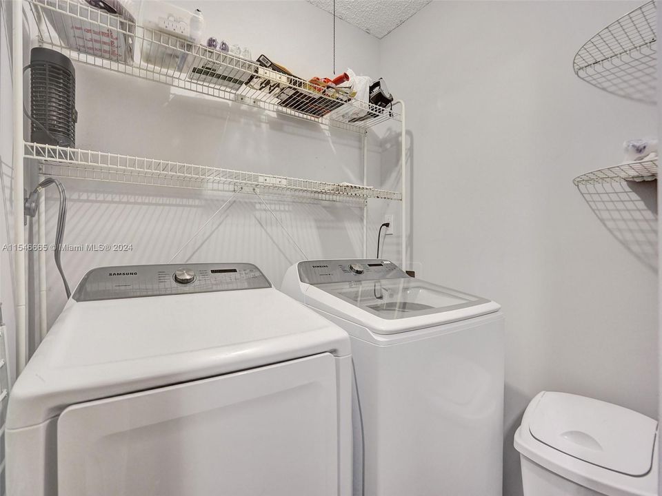 SEPARATE LAUNDRY ROOM WITH FULL SIZE WASHER AND DRYER