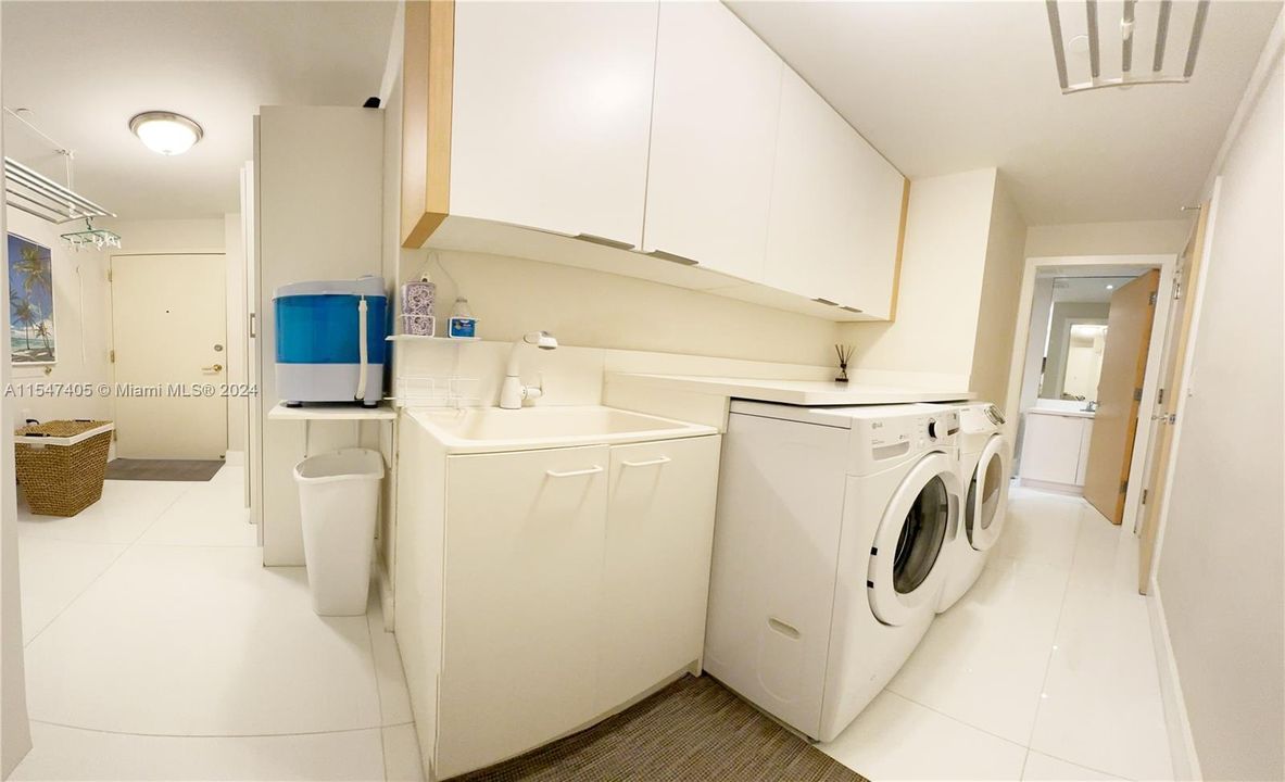 Full laundry room, with retractable staff bed and full bath. Lots of storage & cabinets.