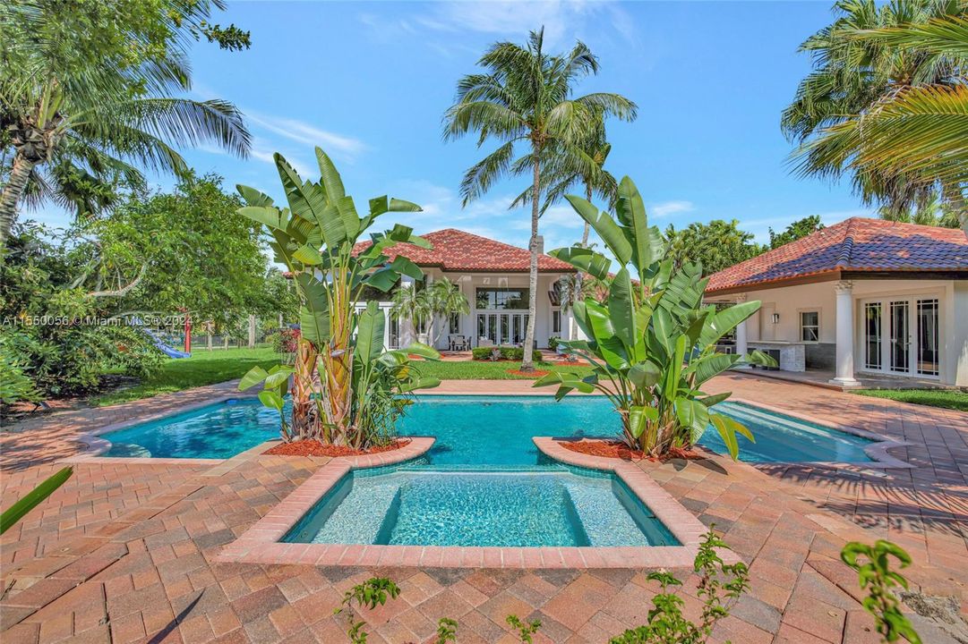 Waterfront estate in coveted Windmill Ranch Estates, with grandfathered-in guest house.