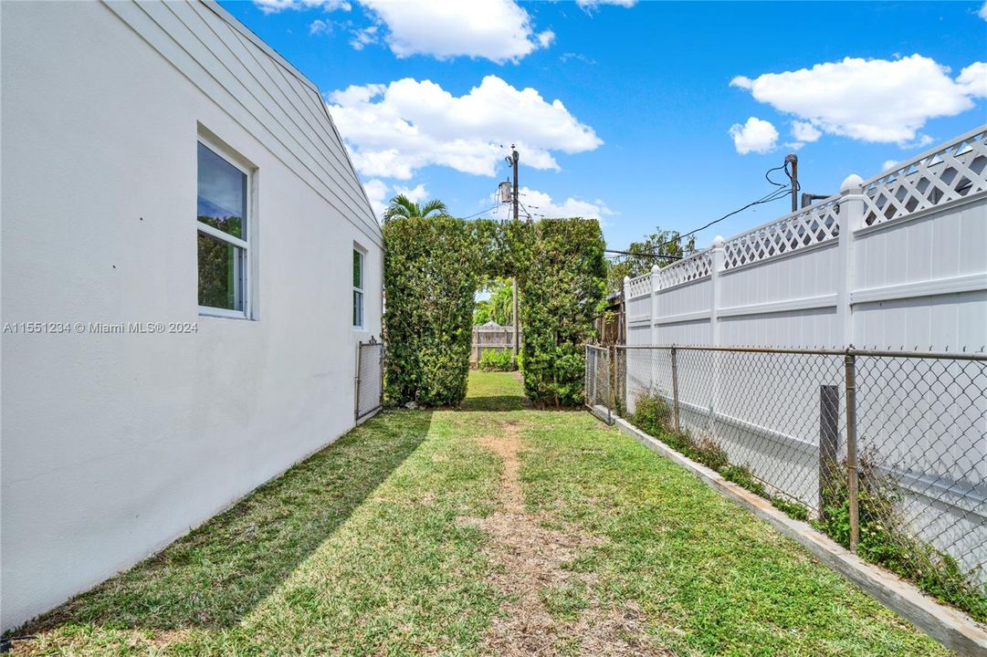 Tailored Hedge arch leads you into the backyard