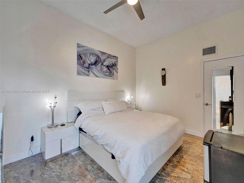 Master bedroom with balcony and walk in closet