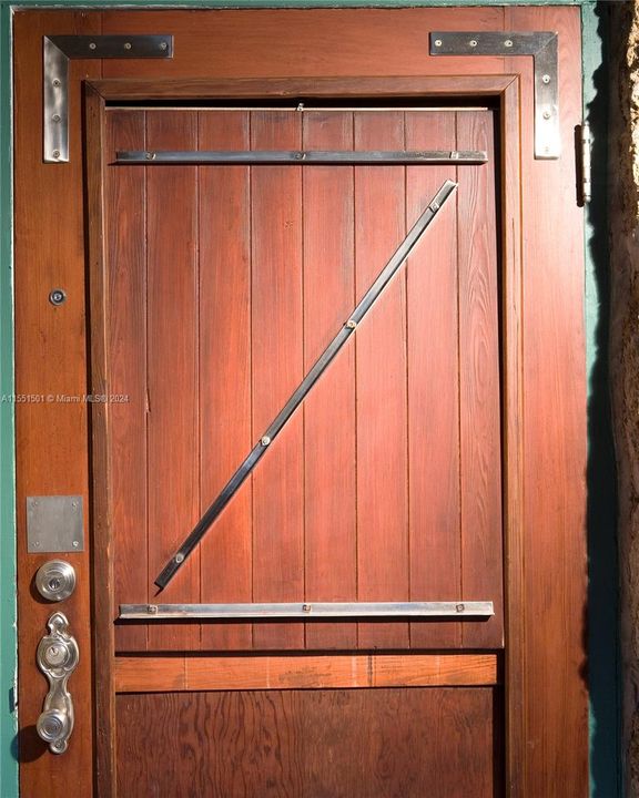 Wood entrance door with 'Z' Zinsmaster initial
