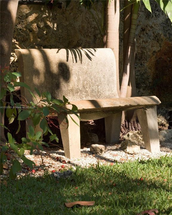 Concrete 'Corbu' benches in garden