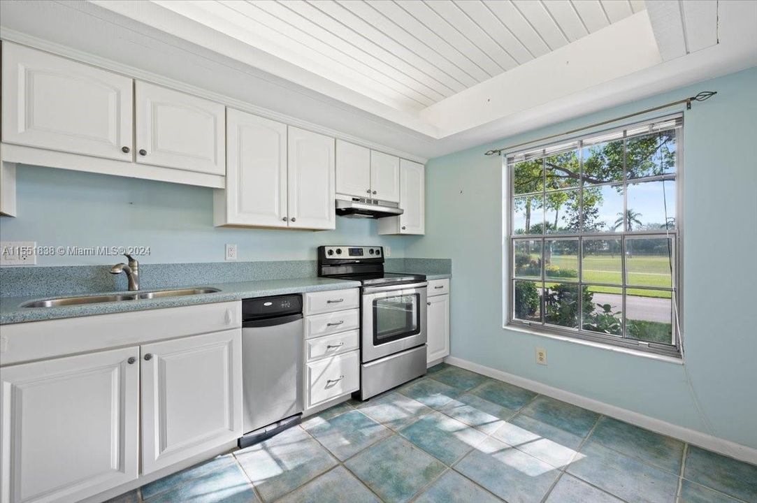 Sunny , bright  , eat in kitchen with newer cabinets, countertops, and SS appliances.