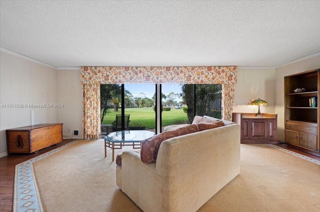 Large living area with beautiful views of a Tom Fazio 18 hole golf course