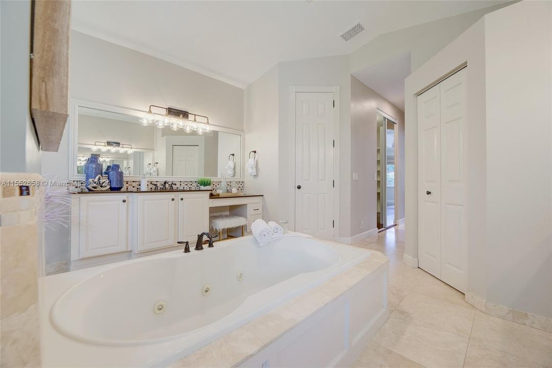 Large tub, linen closet & private water closet