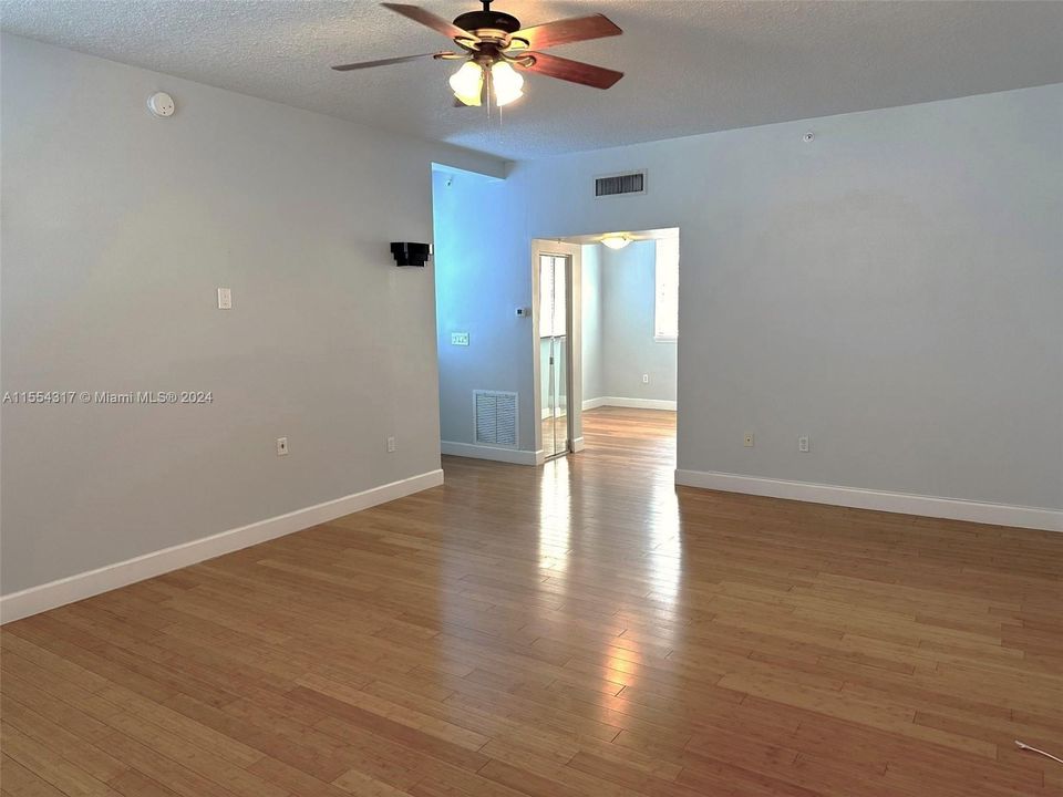 Living Room looking into kitchen and dining