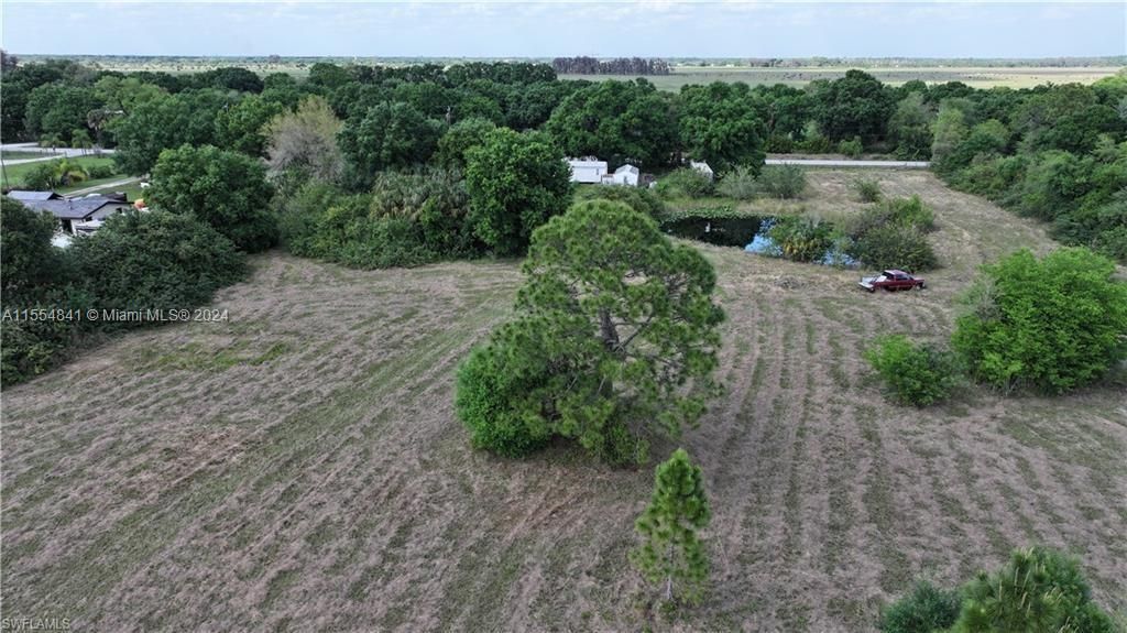 1075 Case Road, LaBelle, Florida, 4.58 acres in no deeded area of Hendry County, Cleared with Pond