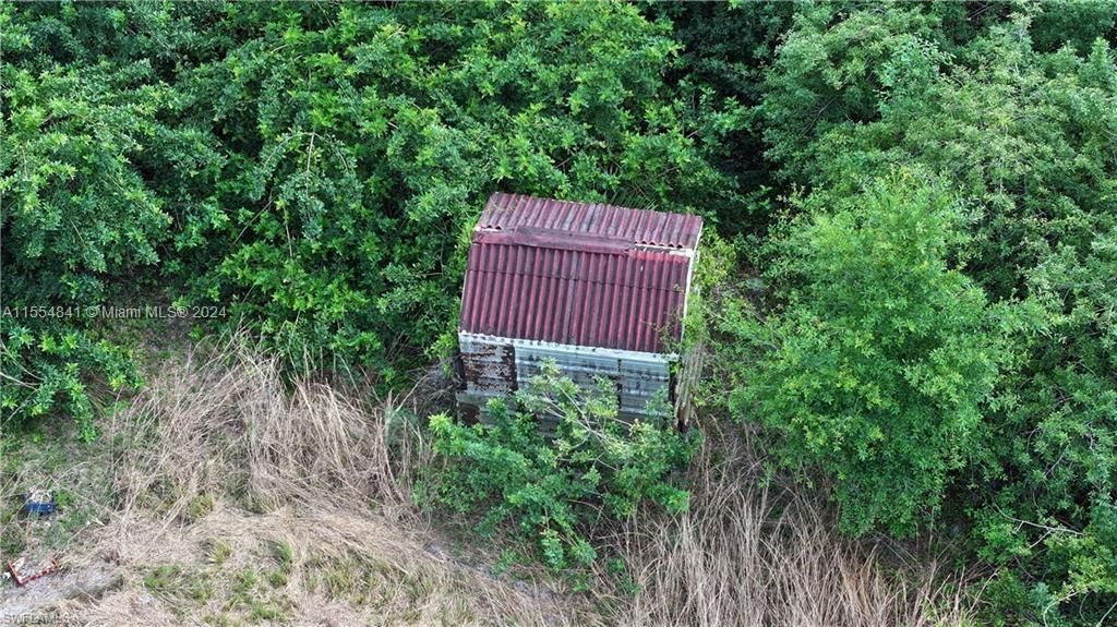 1075 Case Road, LaBelle, Florida, 4.58 acres in no deeded area of Hendry County, Cleared with Pond