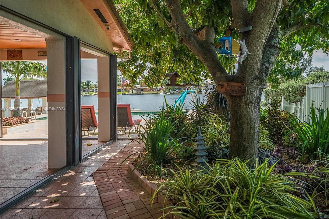 Backyard with Pool, Pavers, Gazebo with Grill, Trees, Dock, Ramp and Sun Deck