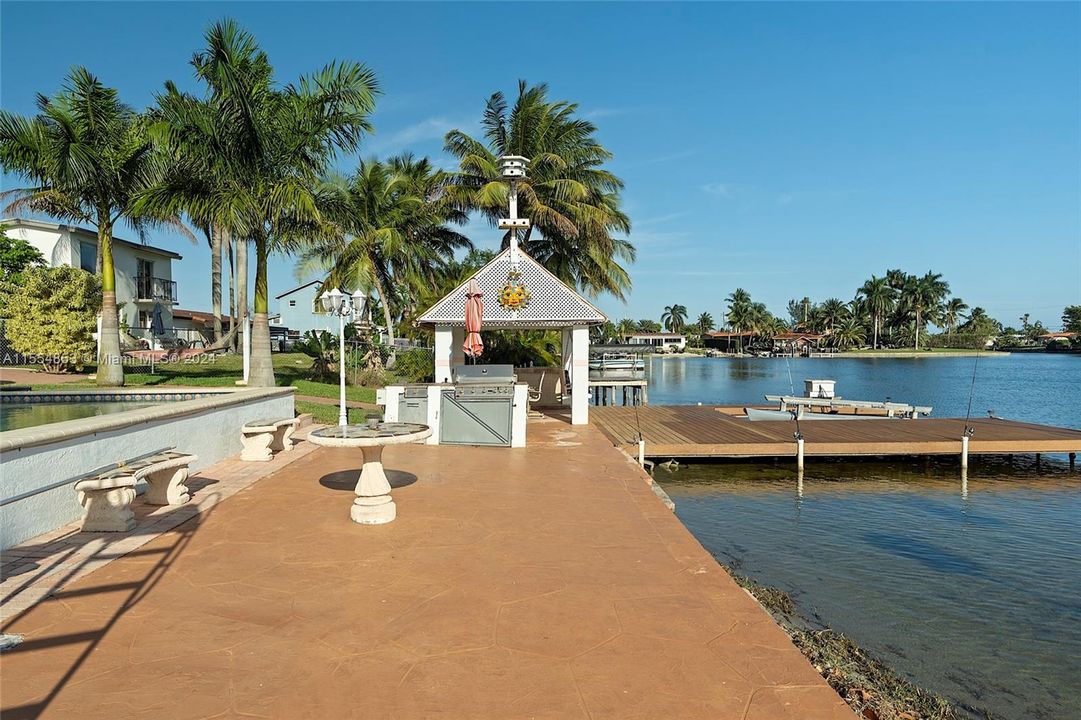 Backyard with Pool, Pavers, Gazebo with Grill, Trees, Dock, Ramp and Sun Deck