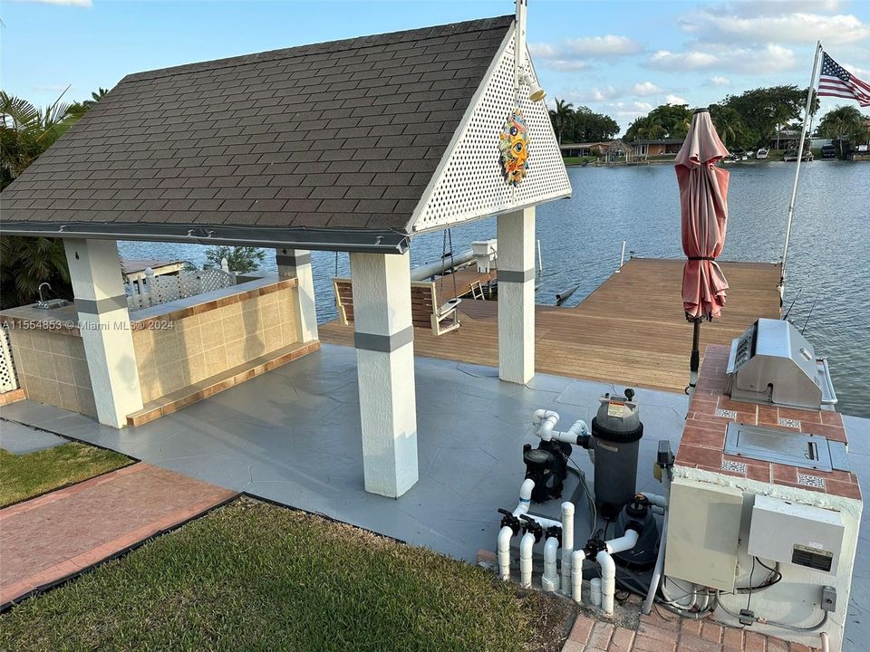 Backyard with Pool, Pavers, Gazebo with Grill, Trees, Dock, Ramp and Sun Deck