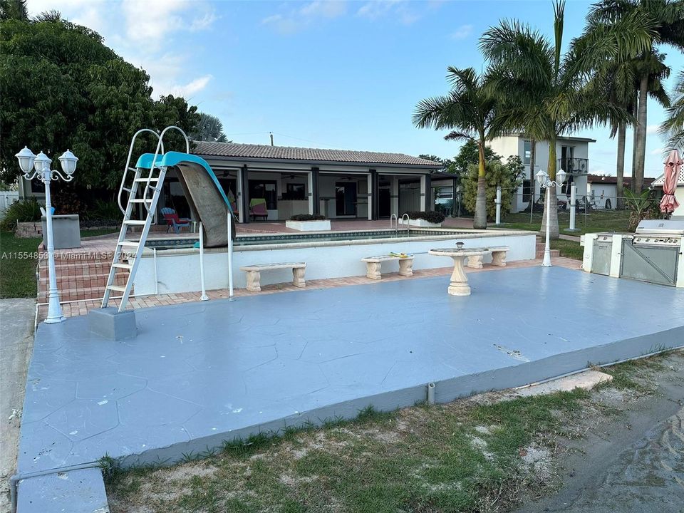 Backyard with Pool, Pavers, Gazebo with Grill, Trees, Dock, Ramp and Sun Deck