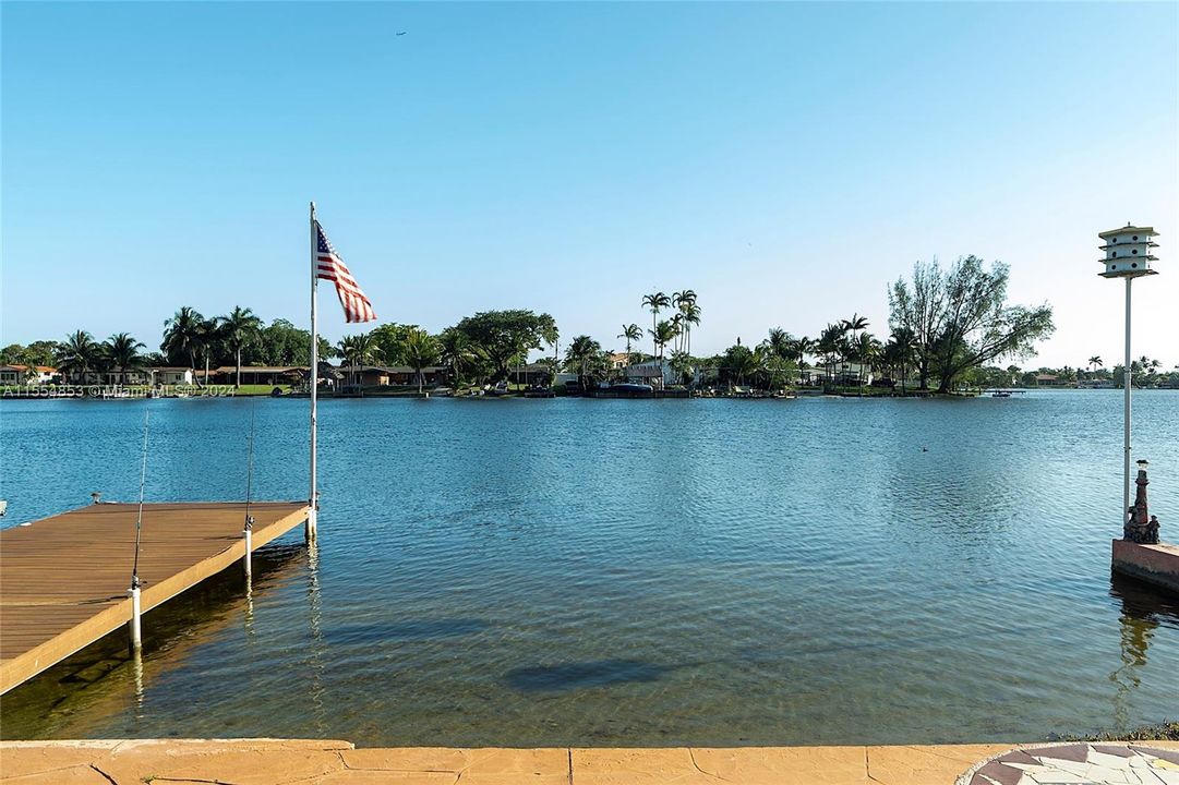 Backyard with Pool, Pavers, Gazebo with Grill, Trees, Dock, Ramp and Sun Deck