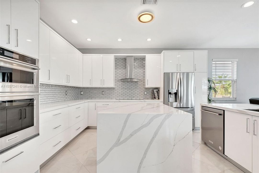 Gorgeous Brand NEW Kitchen with Double Oven - Counter Depth Refrigerator - Stainless Hood - Glass Subway backsplash!  Center Island with cabinets below.