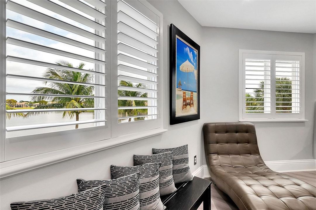 Beautiful lake views from the master bedroom with bahama shutters