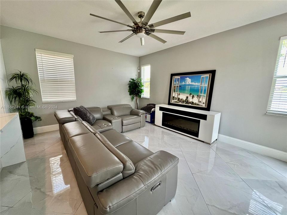Family Room with lots of windows to view Lake!  Check this ceiling fan!