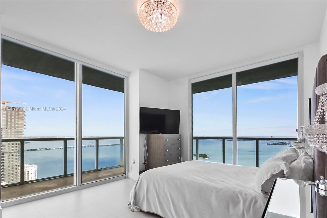 Master bedroom is corner with ample light and a wrap around balcony.  Faces east & north with direct water views.