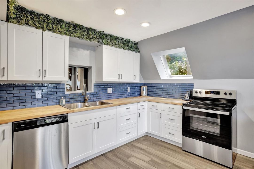 Butcher Block Counters, Shaker Cabinets & Subway tile backsplash