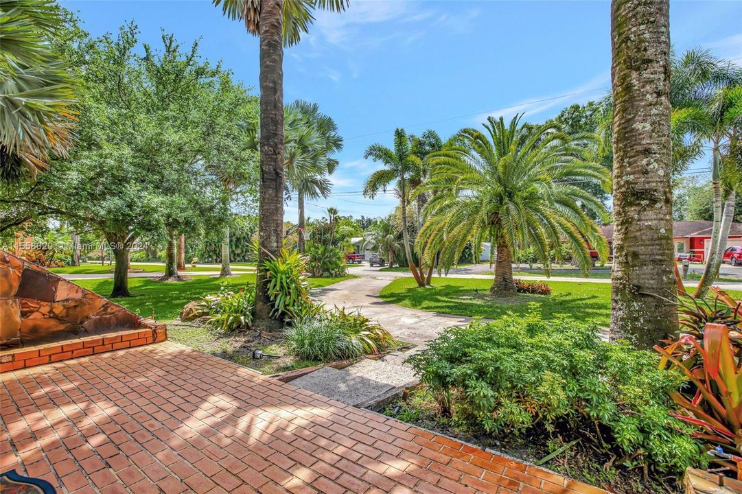 Circular Driveway plus a long driveway adjacent on front of Property. Plus parking by guest house in the rear.