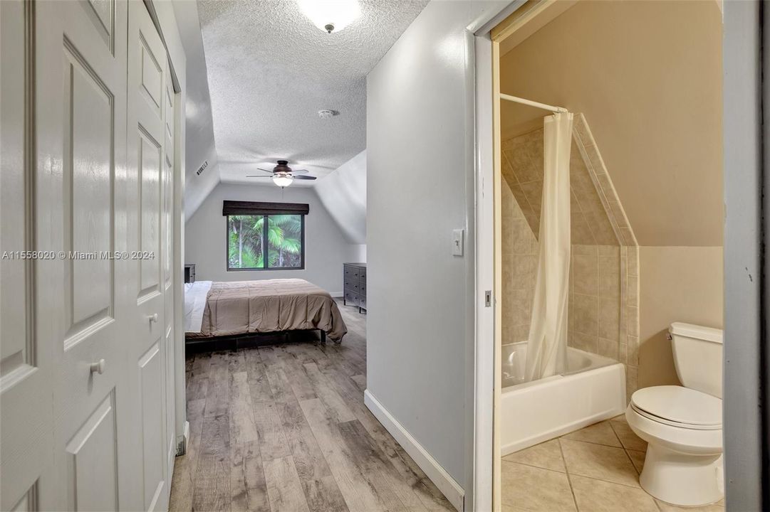 Closets on left and primary bathroom on the right