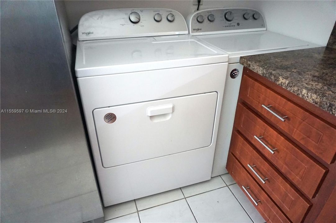 Full size washer/ dryer inside kitchen