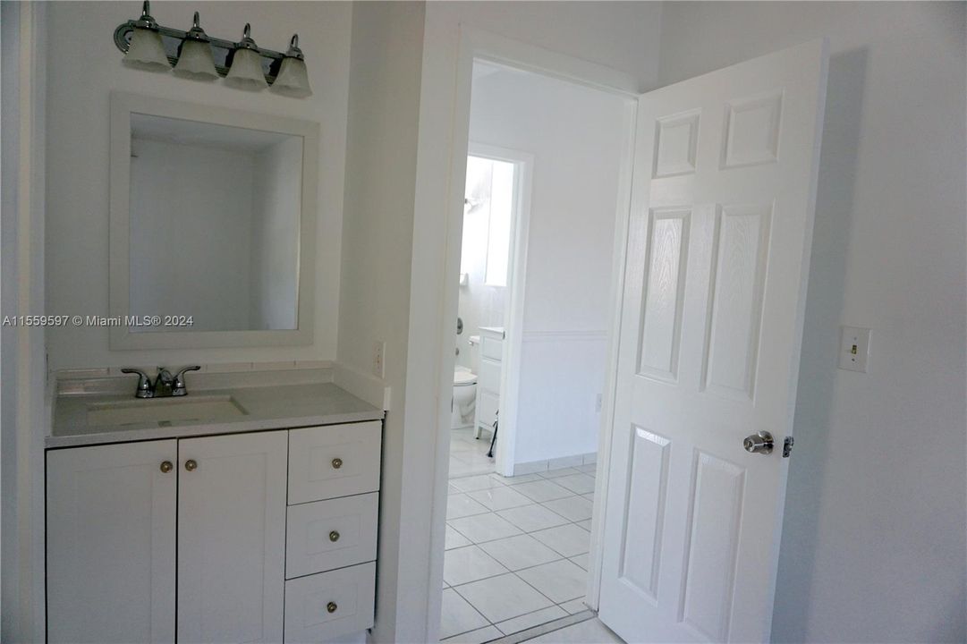 Separate vanity area pictured