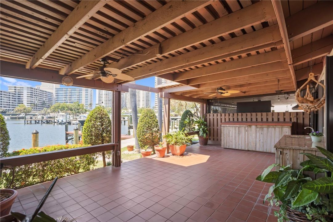 Covered Patio with lots of room to entertain or relax and watch the beautiful sunsets overlooking the deep water canal, no fixed bridges with ocean access.