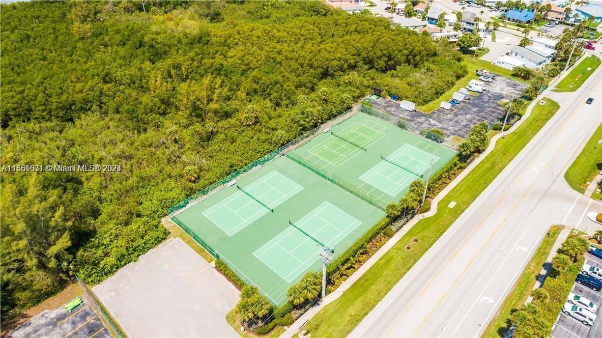 AERIAL VIEW OF TENNIS COURTS ACROSS THE STREET