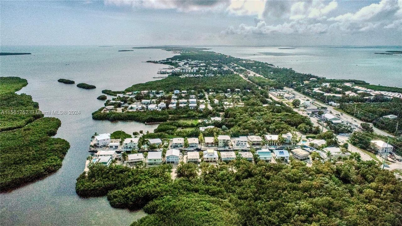 Explore 124 Bahama Road in Key Largo, FL from a different perspective, where serene waterways meet vibrant community living, all under the majestic canopy of Florida’s skies.