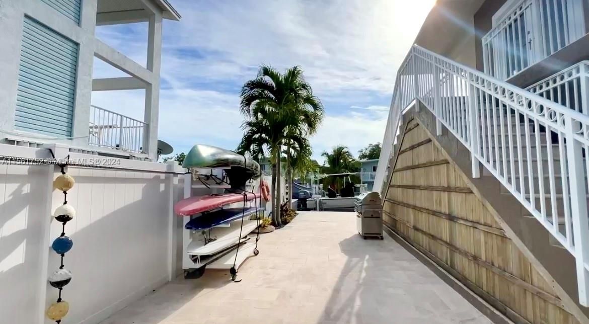 Welcome to the practical side of paradise at 124 Bahama Road, offering secure trailer and RV storage alongside your very own slice of Key Largo's laid-back lifestyle.