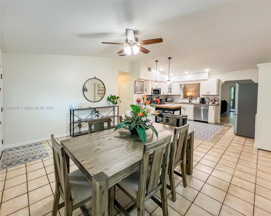 Experience the heart of the home where modern meets comfort—a spacious dining and kitchen area perfect for culinary adventures and cozy family dinners.