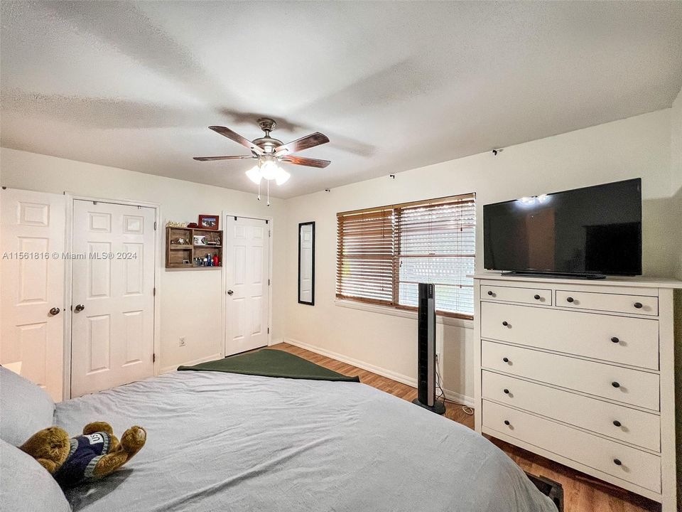 Find tranquility in this inviting bedroom, complete with separate closets for ample storage, ensuring a clutter-free haven for relaxation and peace.