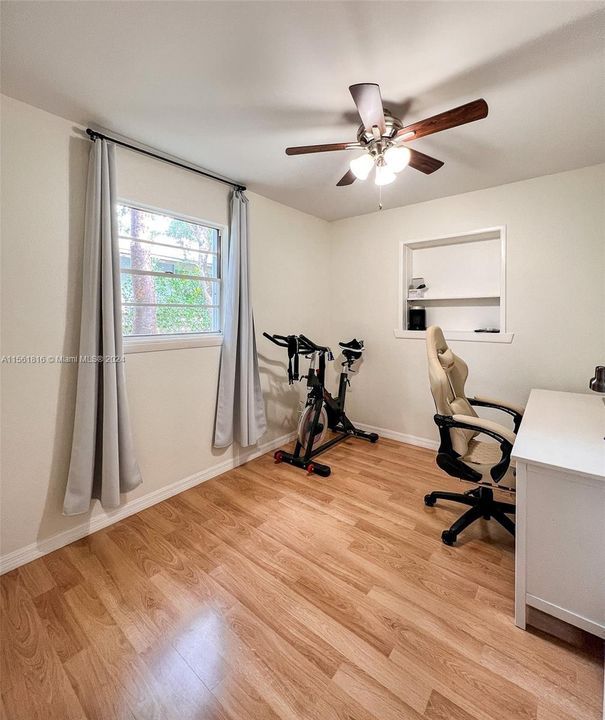 Multifunctional and bright, this room offers the perfect space to balance work and wellness, featuring ample room for a home office and fitness area.
