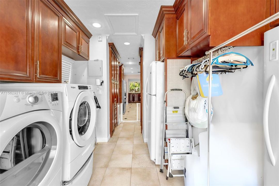 A spacious laundry room with extra storage