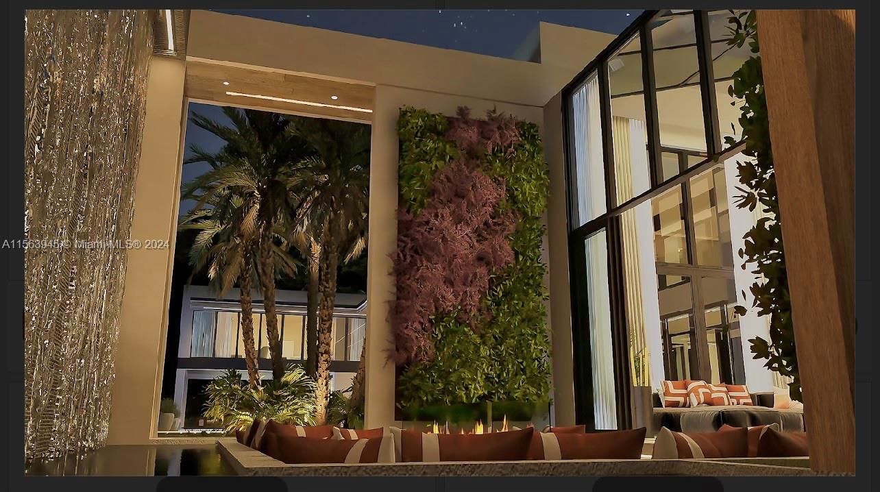 Step inside luxury with our villa's plush interior, accented by ambient lighting and a vertical garden wall, harmonizing indoor opulence with natural greenery for a serene living experience.