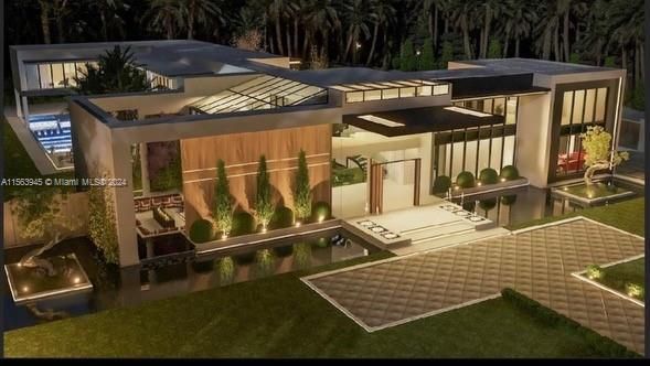 Discover modern elegance with this luxurious, contemporary villa featuring sleek architecture and outdoor sophistication. The night view highlights its striking glass facades, serene pool, and meticulous landscaping, perfect for upscale living.